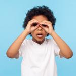 Child using imaginary binoculars